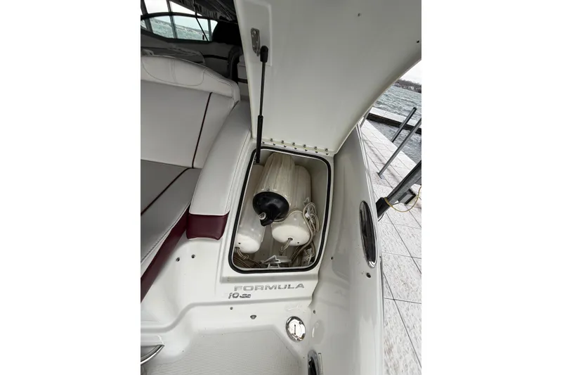 Slide: The Image of 2007 Formula 310 Sun Sport boat storage compartment with fender and ropes. - 10