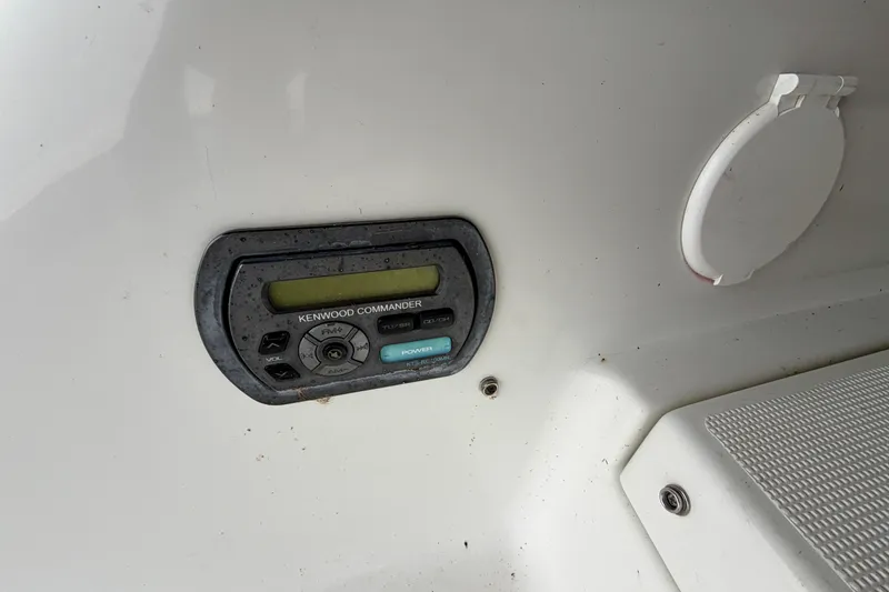 Slide: The Image of Kenwood Commander audio control on 2007 Formula 310 Sun Sport boat dashboard. - 11