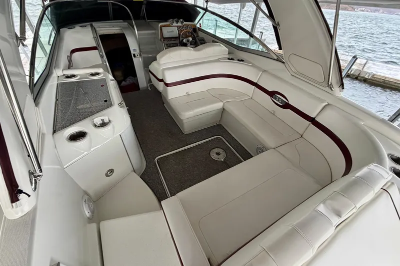 Slide: The Image of 2007 Formula 310 Sun Sport boat interior with white seating and dashboard view. - 13
