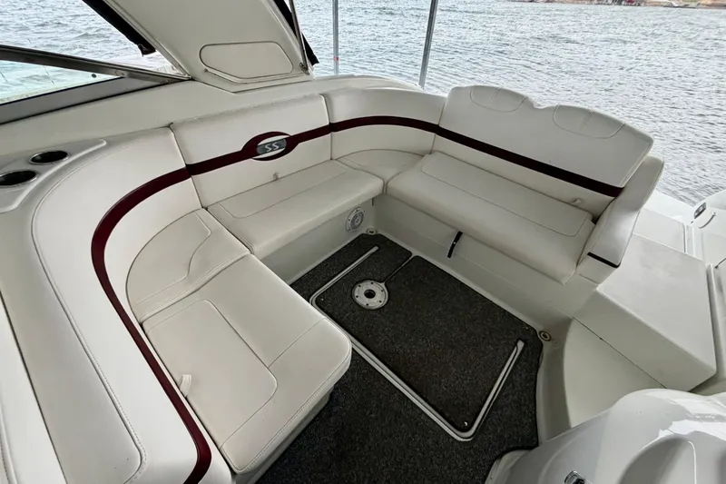 Slide: The Image of 2007 Formula 310 Sun Sport boat interior with white seating and maroon accents. - 14