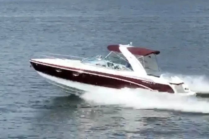 Slide: The Image of 2007 Formula 310 Sun Sport boat cruising on open water. - 2