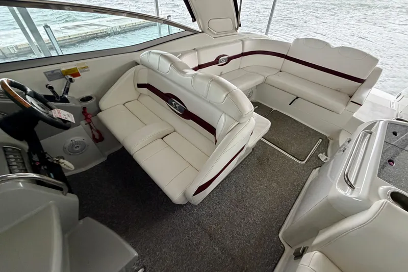 Slide: The Image of 2007 Formula 310 Sun Sport boat interior with white seating and steering wheel. - 20