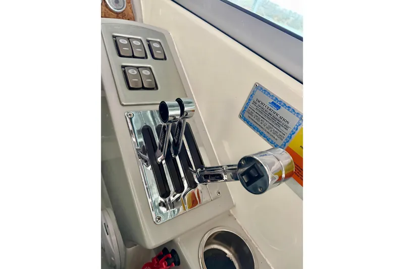 Slide: The Image of Control panel of 2007 Formula 310 Sun Sport boat with throttle levers and switches. - 25