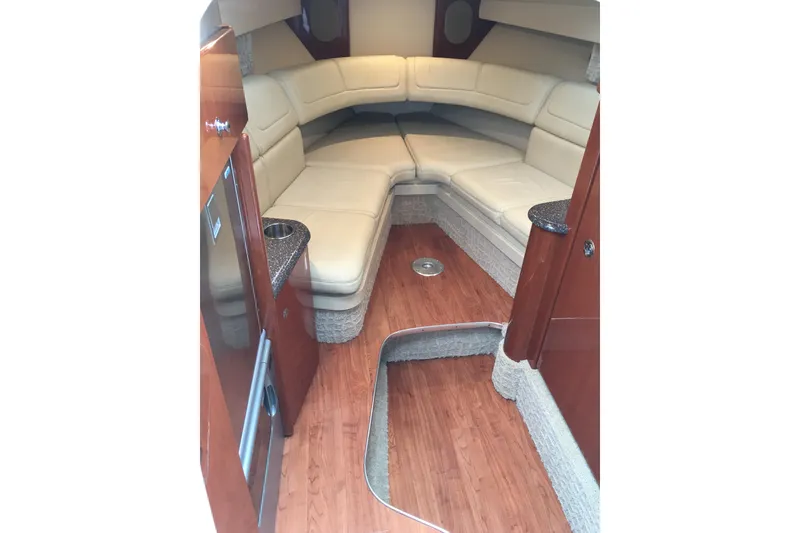 Slide: The Image of 2007 Formula 310 Sun Sport interior with beige seating and wood flooring. - 31