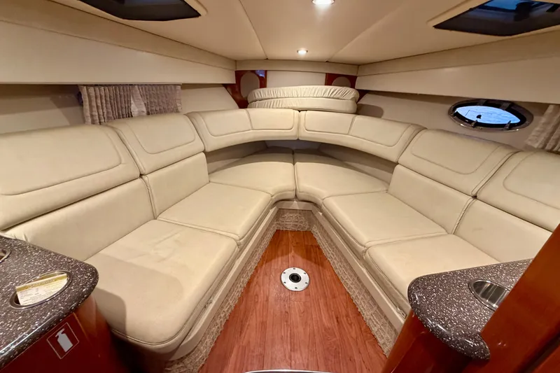 Slide: The Image of Luxurious interior of 2007 Formula 310 Sun Sport boat with beige seating and wood flooring. - 32