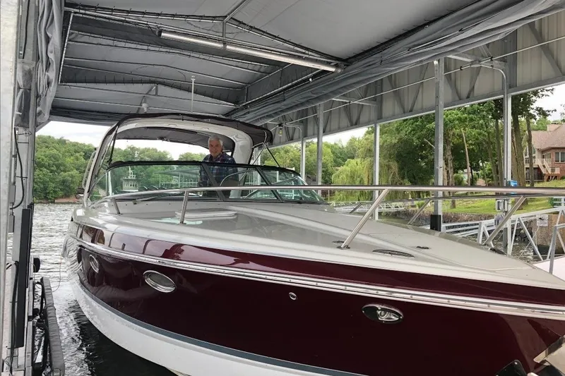 Slide: The Image of 2007 Formula 310 Sun Sport boat docked under a covered marina. - 4