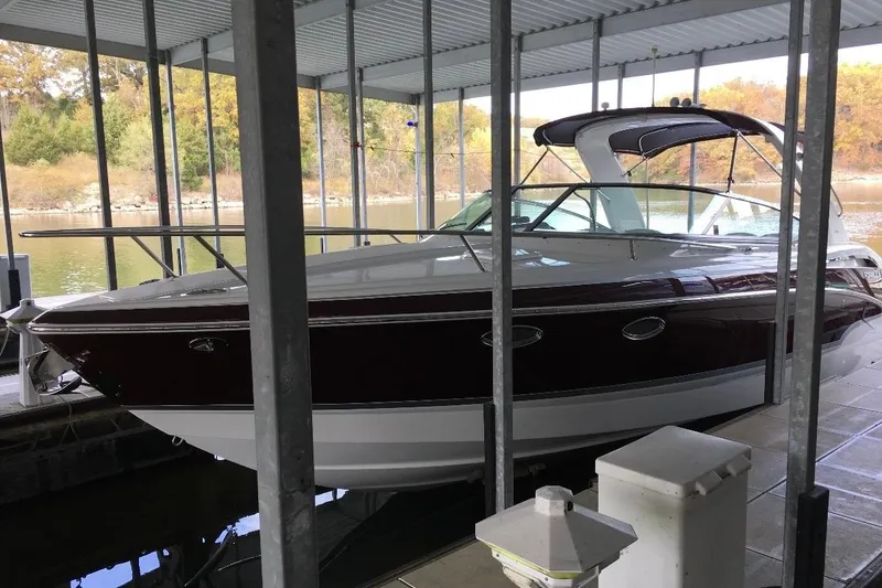 Slide: The Image of 2007 Formula 310 Sun Sport boat docked under a covered marina. - 5