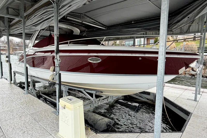 Slide: The Image of 2007 Formula 310 Sun Sport boat docked in a covered marina. - 6