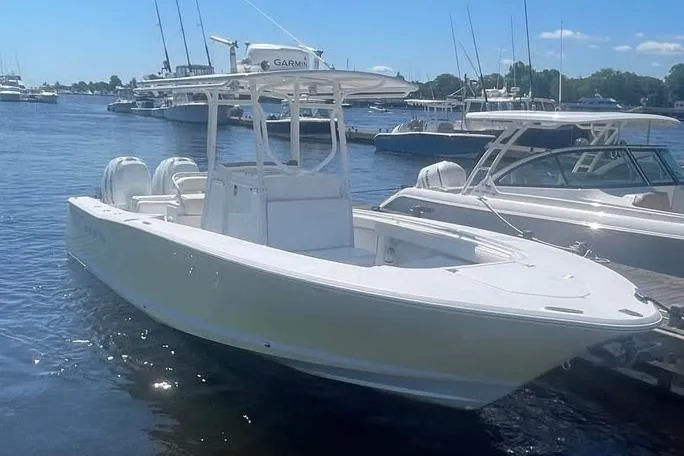 The Image of 2005 Southport 26 Center Console boat docked in a marina. - 0