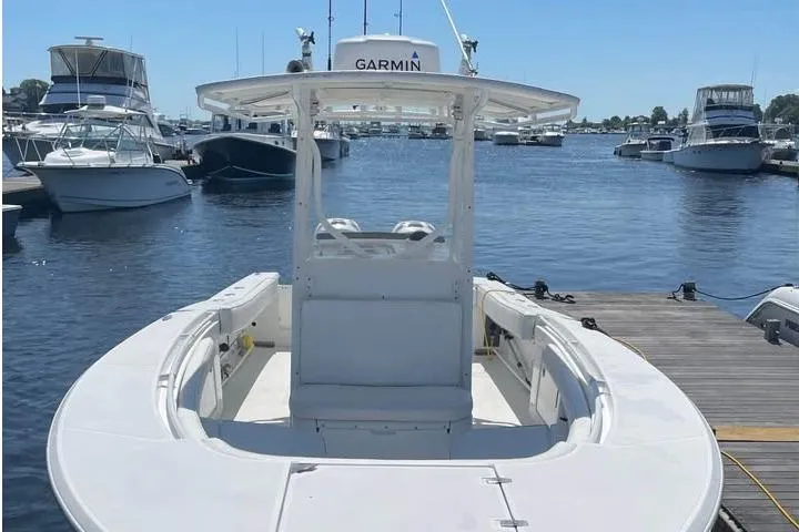Slide: The Image of 2005 Southport 26 Center Console boat docked at a marina, featuring Garmin equipment. - 4