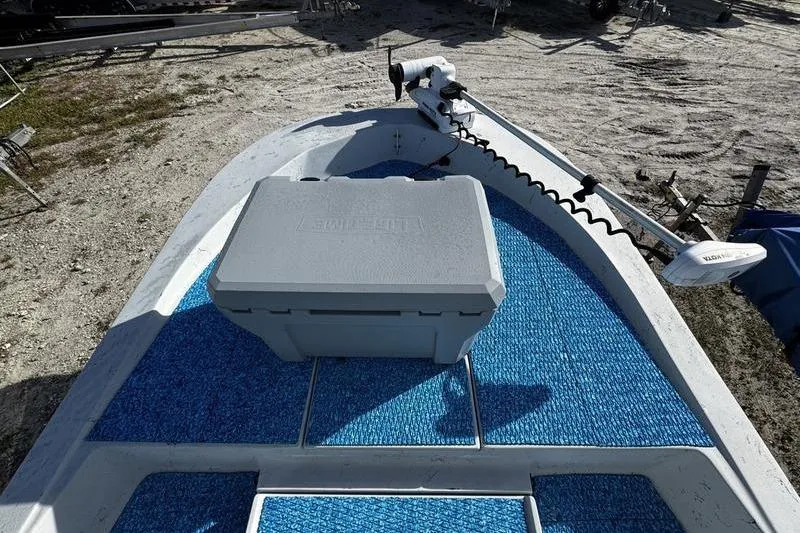 Slide: The Image of 2001 Gulf Coast 200 boat with blue deck and trolling motor. - 10