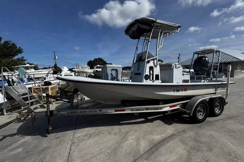 The Image of 2001 Gulf Coast 200 boat on trailer under clear blue sky. - 3