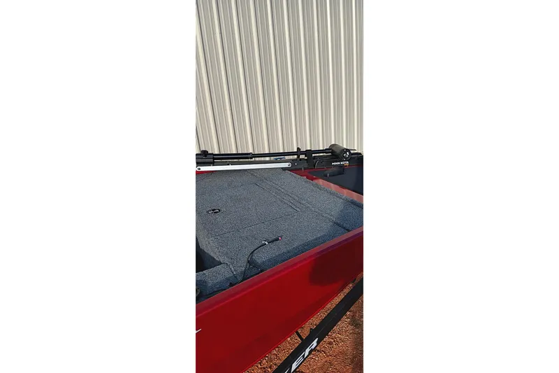 Slide: The Image of 2026 Tracker Panfish 17 boat with gray interior and red exterior. - 18