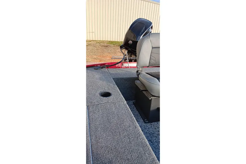 Slide: The Image of 2026 Tracker Panfish 17 boat interior with seating and motor view. - 4