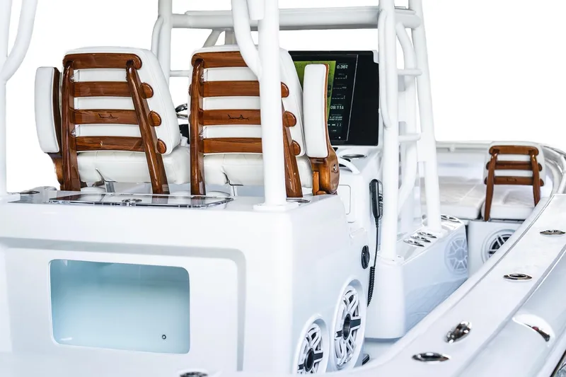 Slide: The Image of 2026 Barker Boatworks 26 Open interior with wooden accents and modern controls. - 12