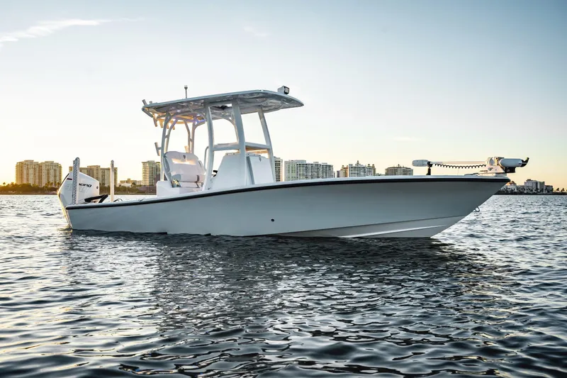 Slide: The Image of 2026 Barker Boatworks 26 Open on water with city skyline backdrop. - 3