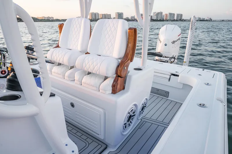 Slide: The Image of 2026 Barker Boatworks 26 Open with luxurious seating and modern design on the water. - 10