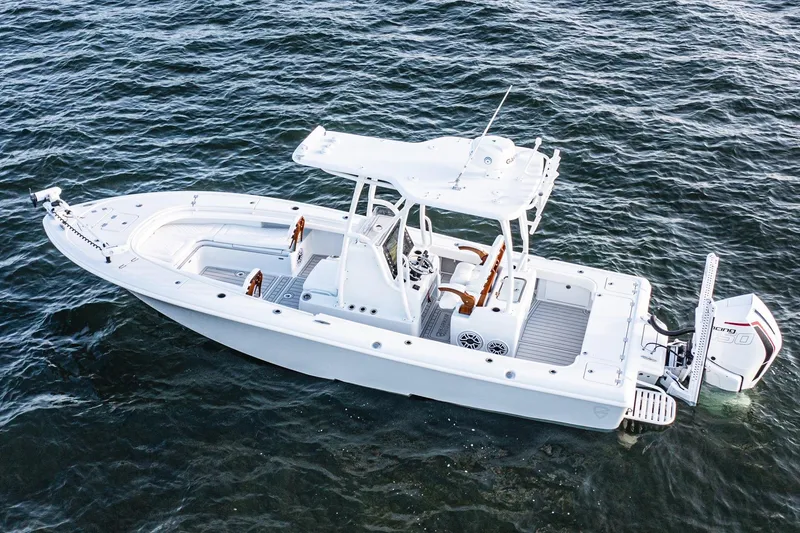 Slide: The Image of 2026 Barker Boatworks 26 Open on water, showcasing sleek design and modern features. - 14