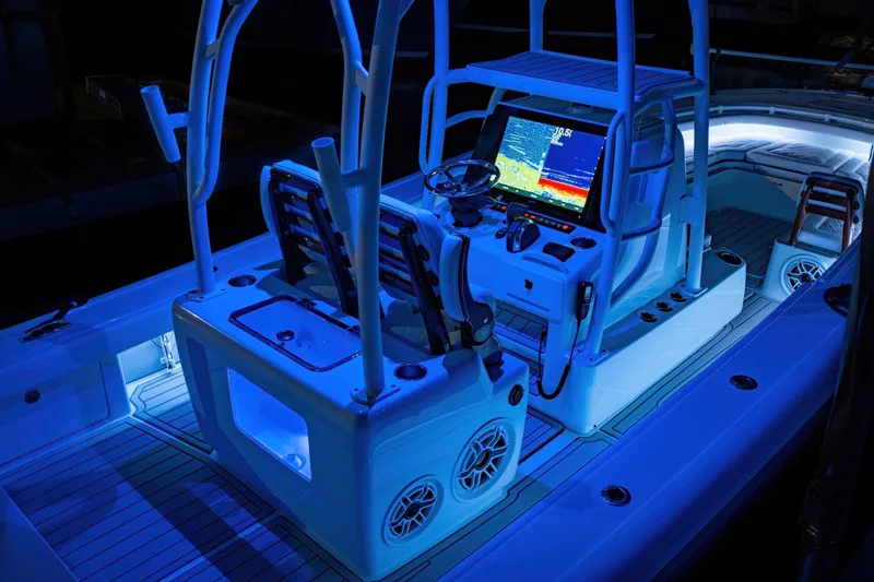 Slide: The Image of 2026 Barker Boatworks 26 Open with illuminated console and advanced navigation system. - 5