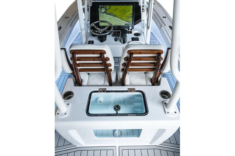 Slide: The Image of 2026 Barker Boatworks 26 Open helm with advanced navigation system and seating. - 9