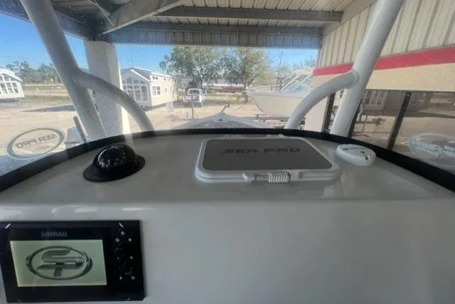 Slide: The Image of 2021 Seapro 248 boat dashboard with navigation equipment and controls. - 11