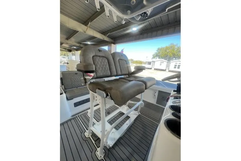 Slide: The Image of 2021 Seapro 248 boat interior with cushioned seating and modern design. - 12