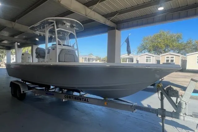 Slide: The Image of 2021 Seapro 248 boat on trailer under shelter, side view. - 17