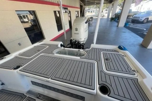Slide: The Image of 2021 Seapro 248 boat with Suzuki 300 outboard motor, featuring spacious deck layout. - 19