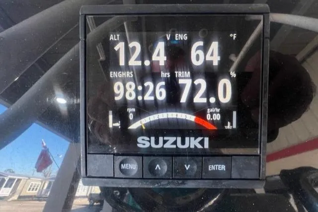 Slide: The Image of Suzuki engine display showing 12.4 volts, 64°F, 98:26 engine hours, 72% trim. - 21