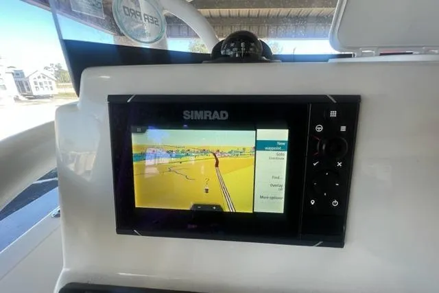Slide: The Image of Simrad navigation system on 2021 Seapro 248 boat dashboard. - 4