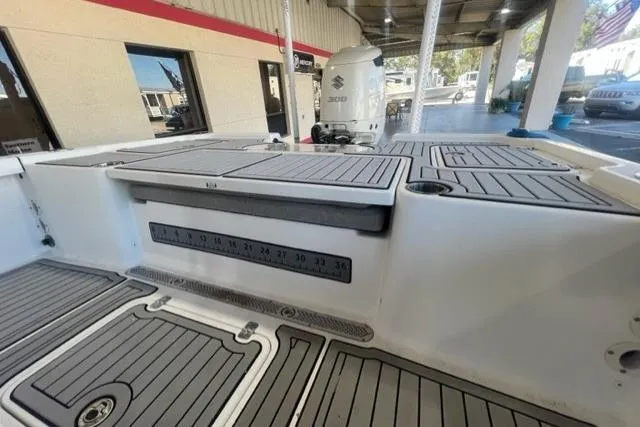Slide: The Image of 2021 Seapro 248 boat deck with Suzuki 300 engine, featuring non-slip flooring. - 6
