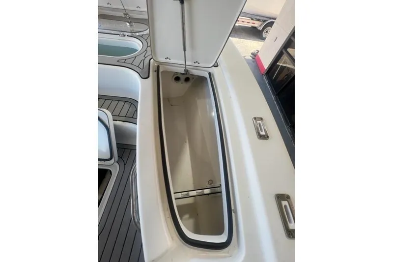 Slide: The Image of Open storage compartment on 2021 Seapro 248 boat deck. - 9