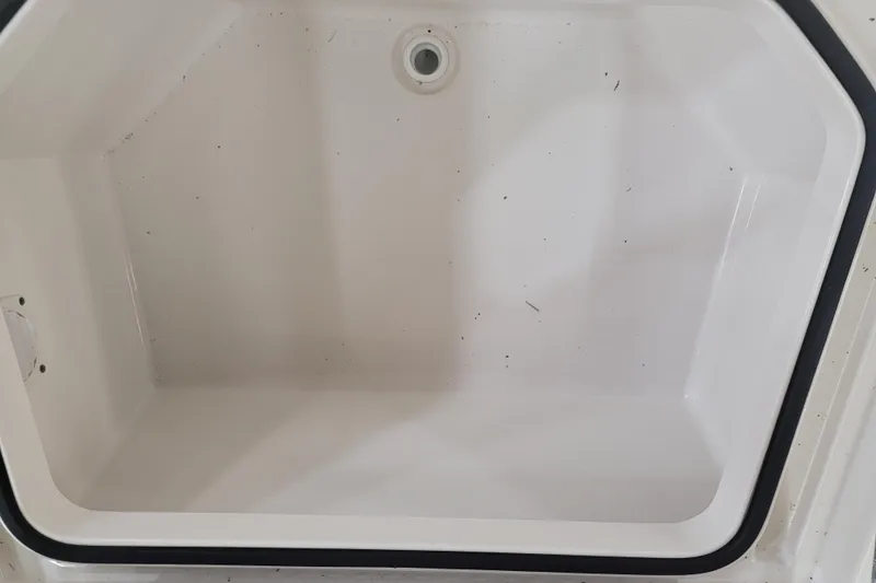 Slide: The Image of 2025 Ranger 2360 Bay boat storage compartment, clean and spacious interior. - 17