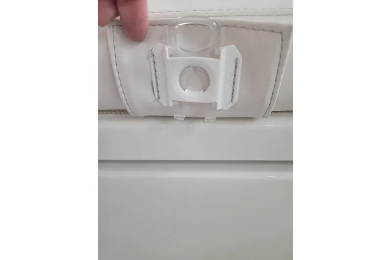 Slide: The Image of White seat latch on 2025 Ranger 2360 Bay boat. - 21