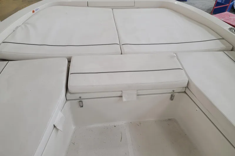 Slide: The Image of 2025 Ranger 2360 Bay boat interior with white cushioned seating. - 22