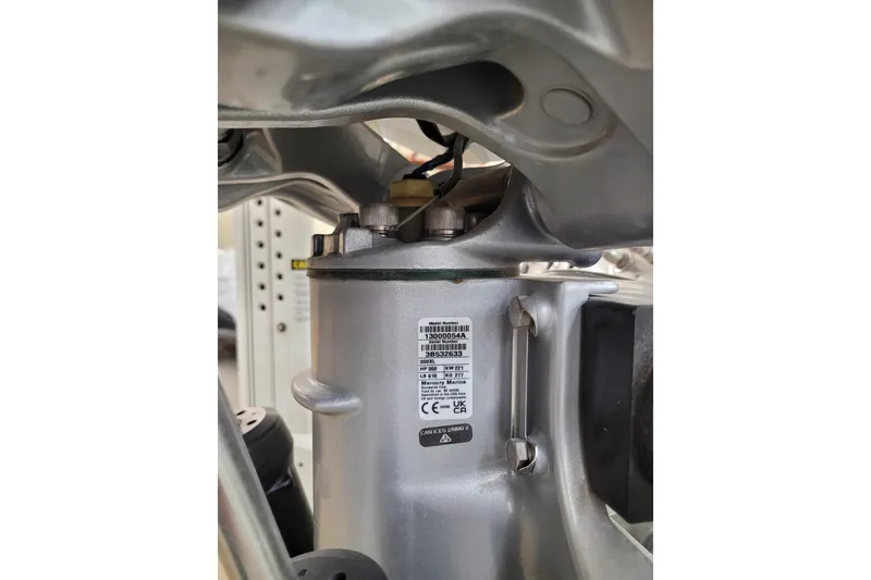 Slide: The Image of Close-up of a 2025 Ranger 2360 Bay engine component with label details. - 31