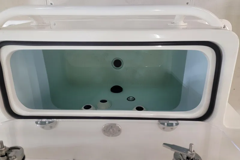 Slide: The Image of Livewell compartment of 2025 Ranger 2360 Bay boat, featuring a clear viewing window. - 4