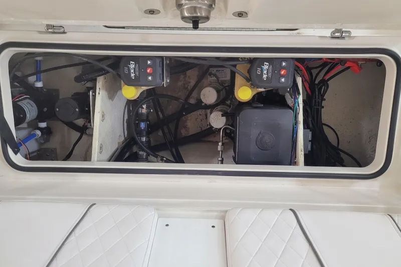Slide: The Image of 2025 Ranger 2360 Bay boat interior showing electrical and mechanical components. - 7