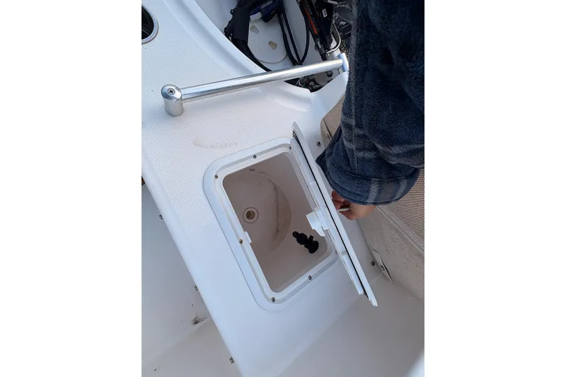 Slide: The Image of Open hatch on 2018 Release Boatworks 196 RK, showing interior compartment. - 10