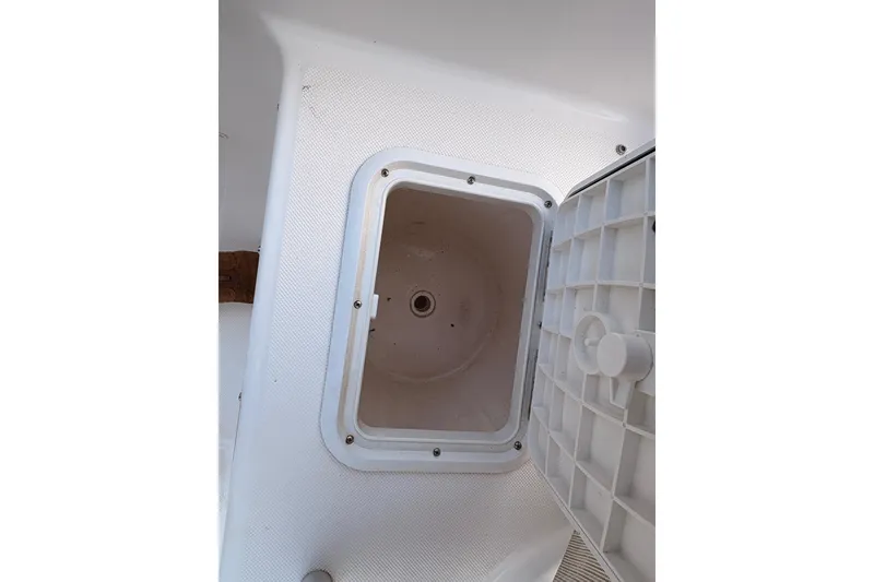 Slide: The Image of Open storage compartment on 2018 Release Boatworks 196 RK boat. - 11