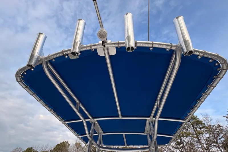 Slide: The Image of Blue canopy and rod holders on 2018 Release Boatworks 196 RK. - 13