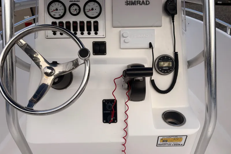Slide: The Image of Steering console of 2018 Release Boatworks 196 RK with gauges and controls. - 14