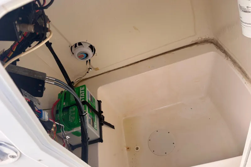 Slide: The Image of Interior view of 2018 Release Boatworks 196 RK, showing battery and wiring components. - 5