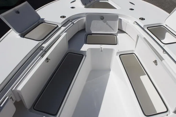 Slide: The Image of 2018 Cape Horn 36 XS boat interior with open storage compartments and seating. - 10