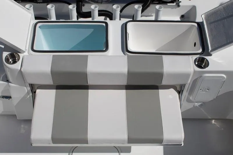Slide: The Image of 2018 Cape Horn 36 XS boat interior with dual livewells and striped seating. - 11