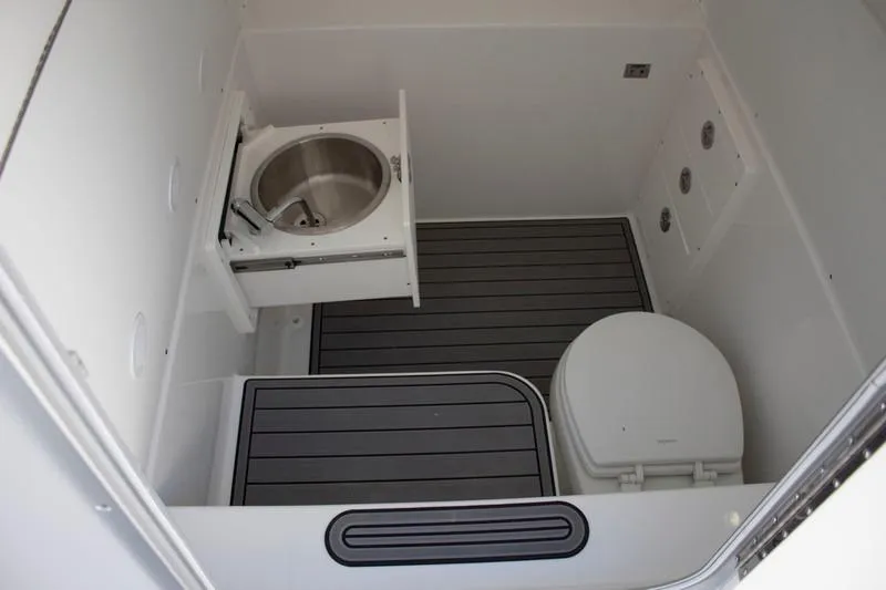 Slide: The Image of Interior of 2018 Cape Horn 36 XS boat bathroom with sink and toilet. - 12