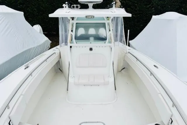 Slide: The Image of 2018 Cape Horn 36 XS boat, white interior, center console, covered storage. - 9