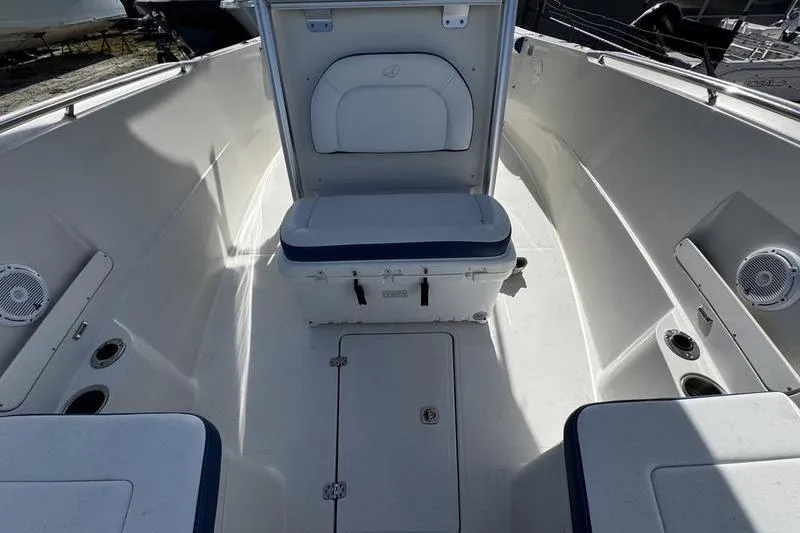 Slide: The Image of 2010 Sailfish 2860 CC boat interior with seating and storage compartments. - 14