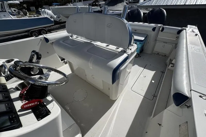 Slide: The Image of 2010 Sailfish 2860 CC boat interior with seating and steering wheel. - 16
