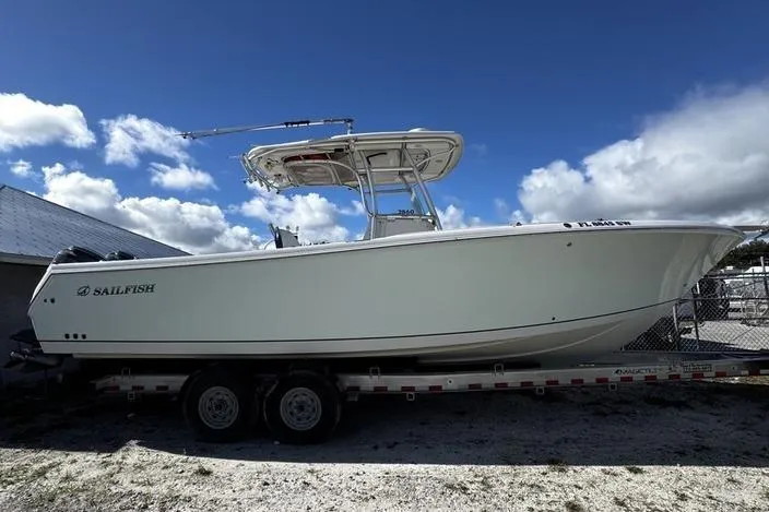 The Image of 2010 Sailfish 2860 CC boat on trailer under blue sky. - 3
